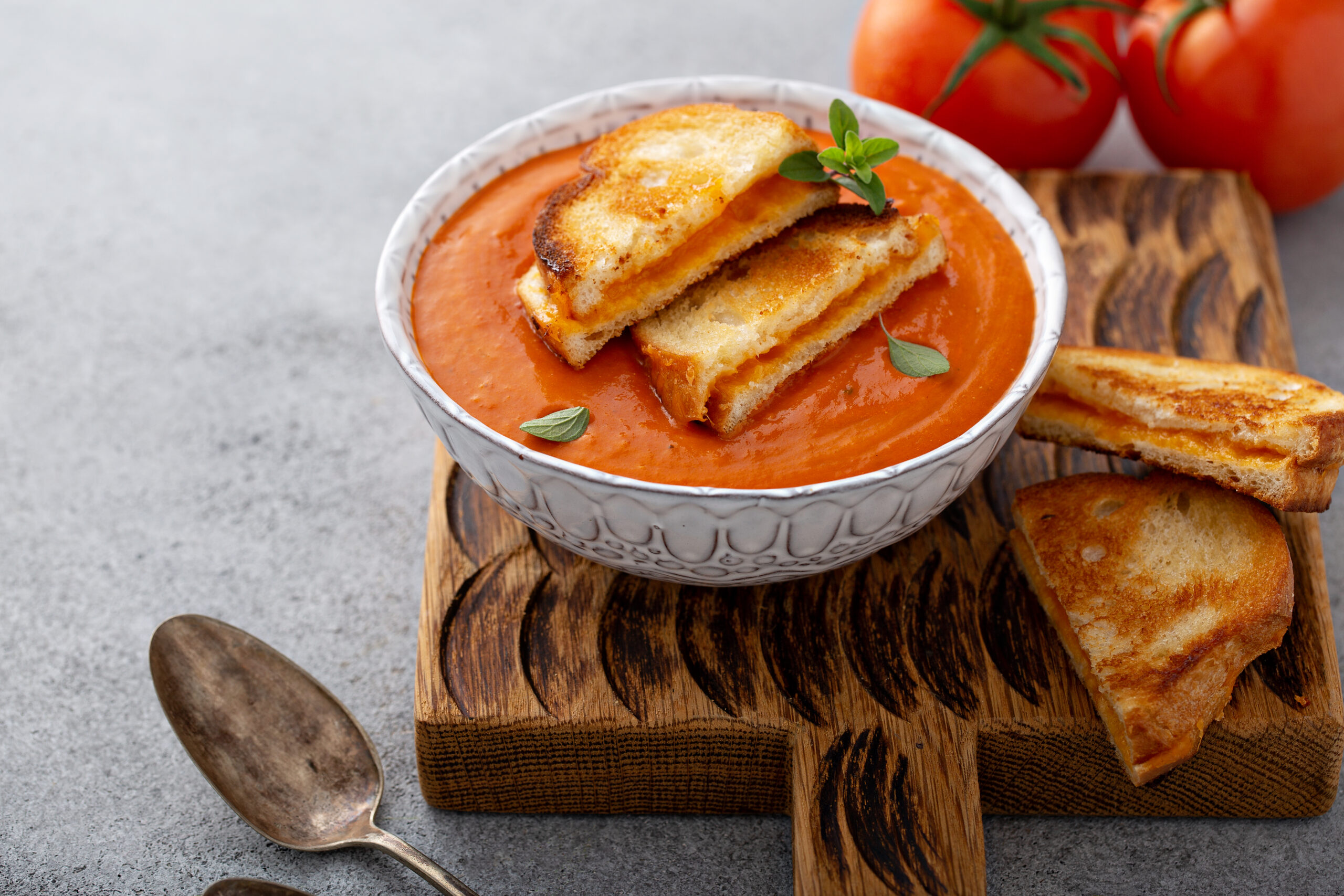 Comforting: Healthy Food Trade-ups: Original Comfort: Grilled Cheese and Tomato Soup There's something undeniably romantic about a crispy, golden grilled cheese sandwich paired with a creamy, savory tomato soup. The scent alone evokes warmth and comfort on a busy or stressful day. But this beloved duo has its downsides when it comes to recovery—high in sodium and carbs, low in fiber, and not exactly heart-friendly.